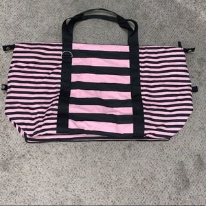 Large pink and black duffel bag
